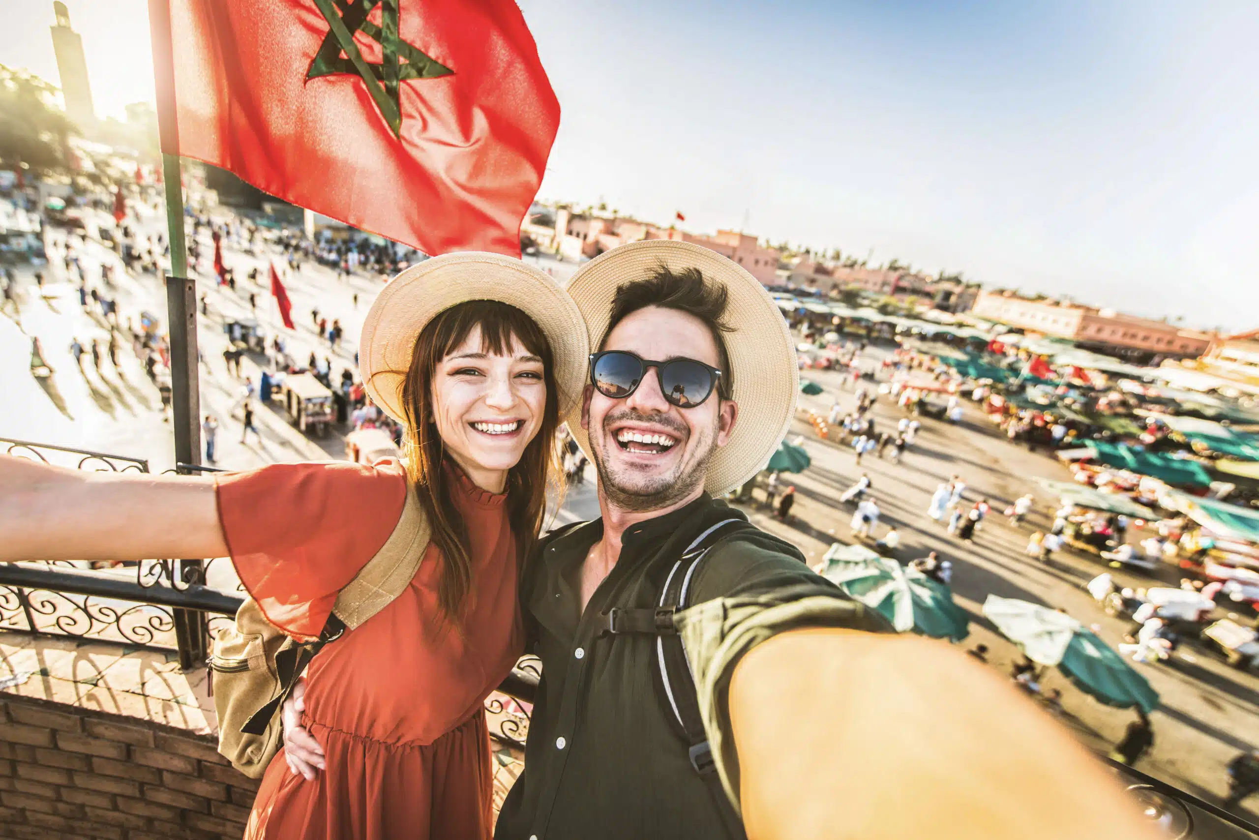 Couple visiting Jamaa el-Fna market Marrakech, Morocco